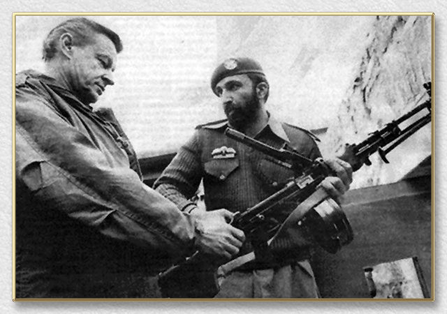Osama bin Ladin giving Ziggy a gun tour