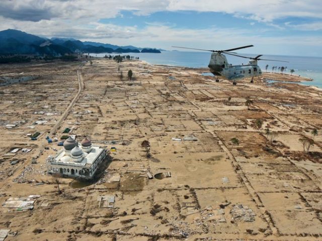 A U.S Marine helicopter flies over Northern Sumatra, Indonesia just a few days after the tsunami