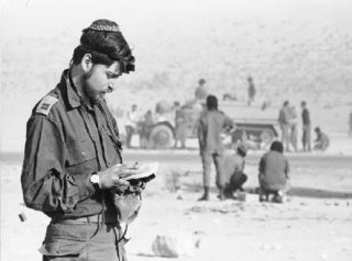 Israeli soldier prays at the start of the Yom Kippur War