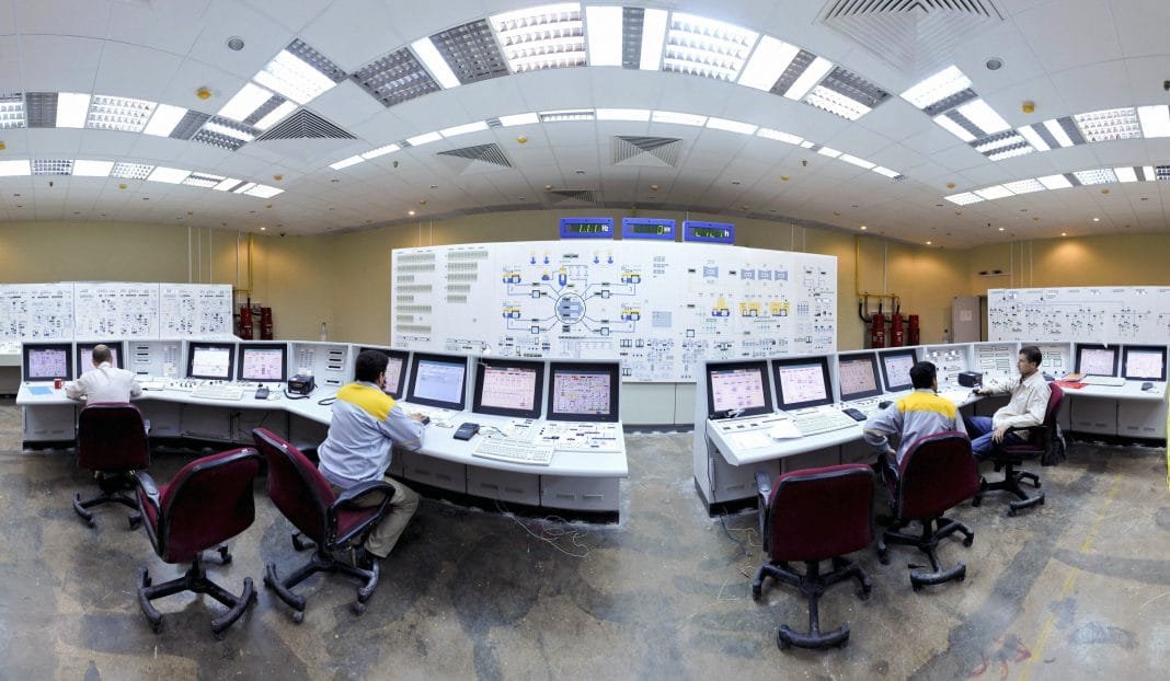 Russian and Iranian operators monitor the nuclear power plant unit in Bushehr