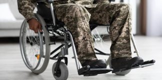 Legs of disabled african american military man in wheelchair